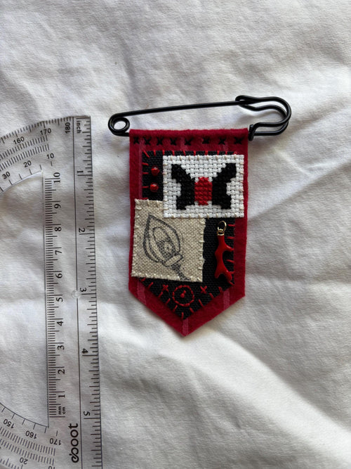 Alastor inspired hand embroidered pin