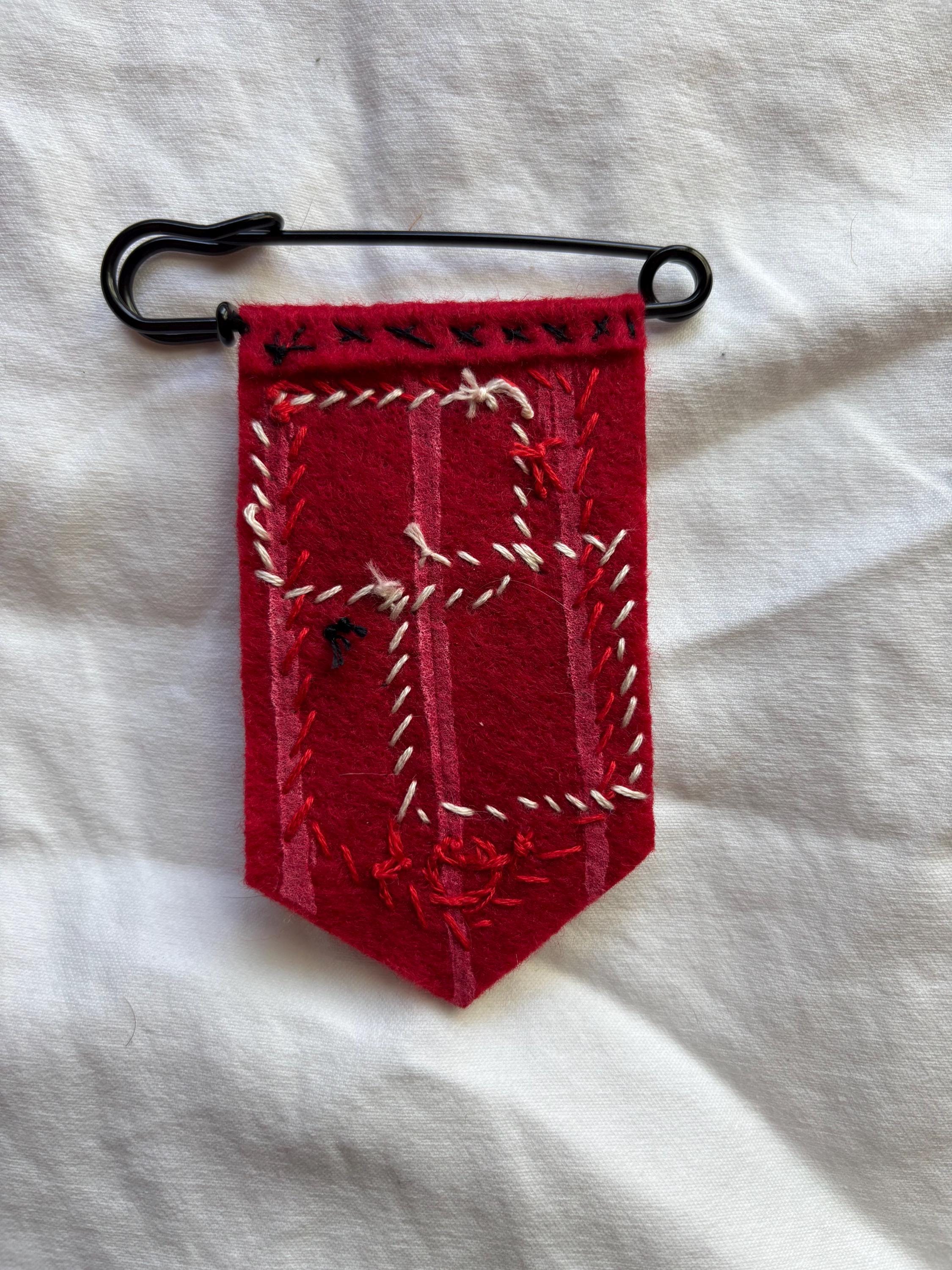 Alastor inspired hand embroidered pin