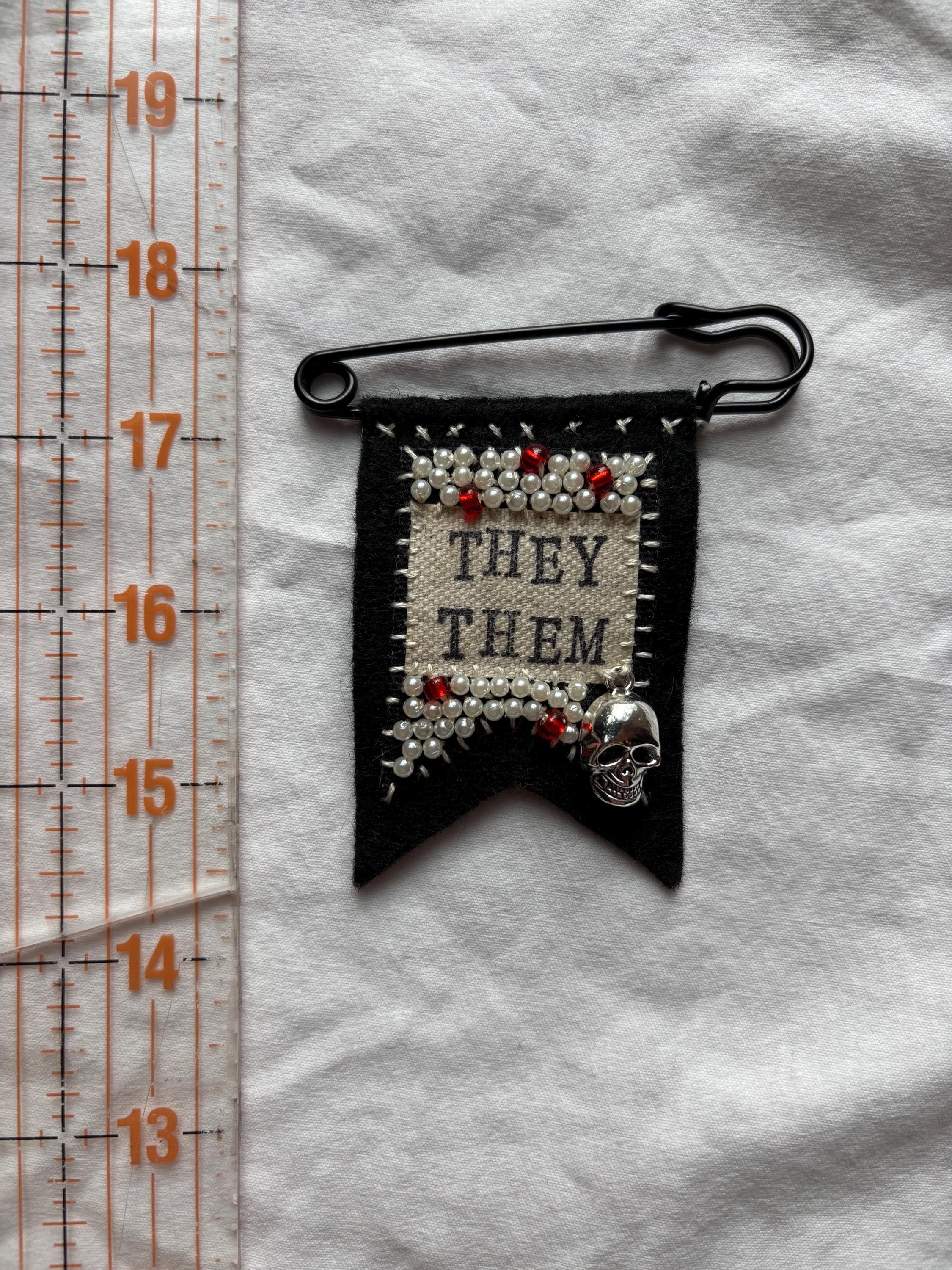 Handmade skull pronoun pin - customizable pronouns