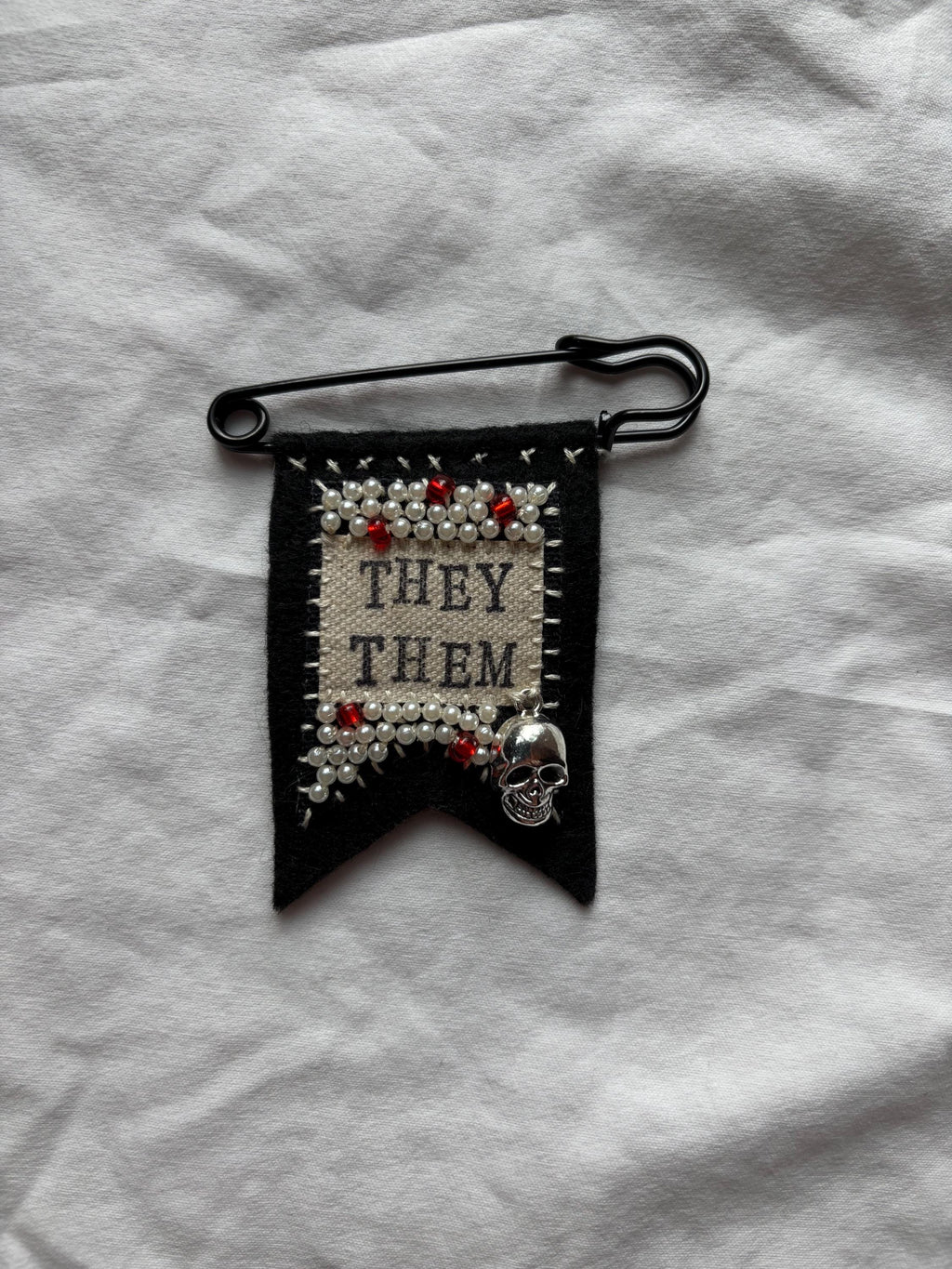 Handmade skull pronoun pin - customizable pronouns