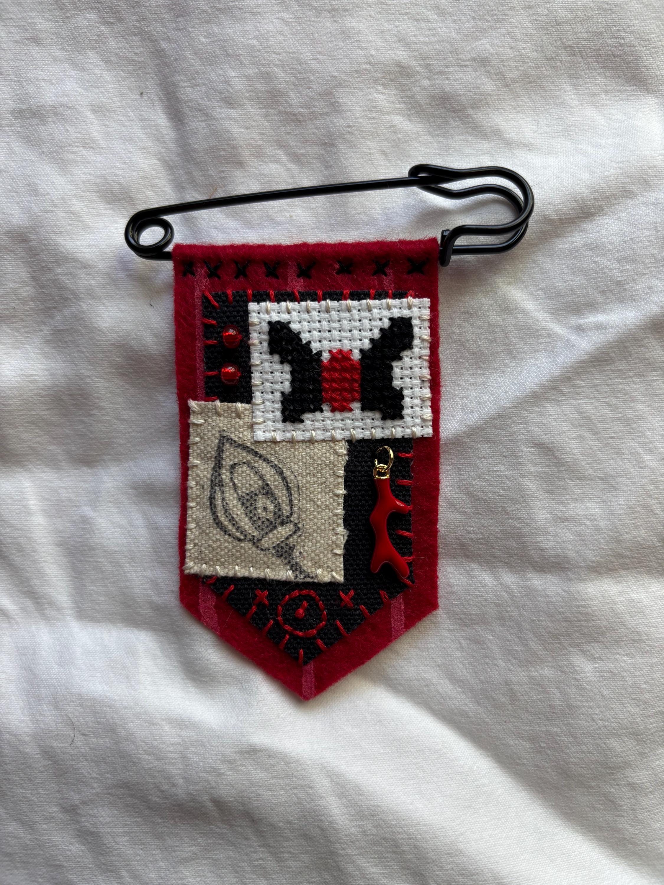 Alastor inspired hand embroidered pin